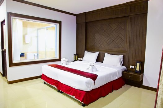 Interior of a room in a modern hotel. A large bed.