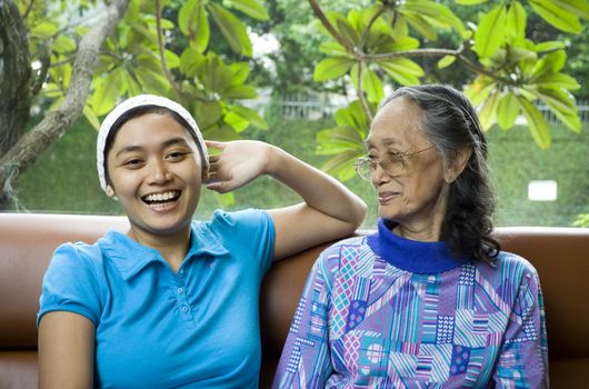 photo of 2 generation woman having some fun conversation