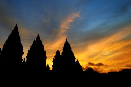 Dramatic sky with sun setting at Hindu temple Prambanan. Indonesia, Central Java, Yogyakarta 