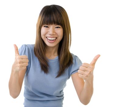 Asian student thumbs up with great smile, empty book ready for text.