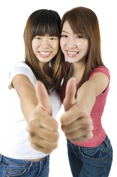 Young Asian University student giving thumbs up sign.