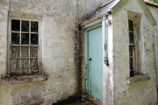 an old decaying cottage front in ireland
