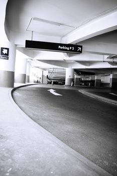 perspective view of a pathway leading to empty parking lot of a building