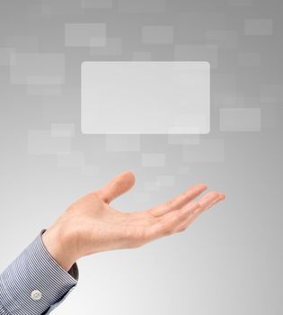Business hand propose floating touch screens on a light gray background.