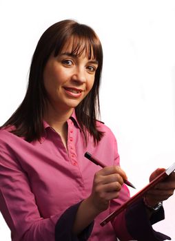 Woman in fushia shirt takes notes, isolated over white