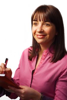 Woman takes notes and smiles, isolated over white