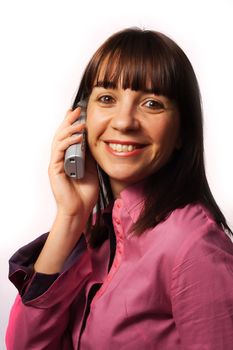 Woman on the phone smiles, isolated over white
