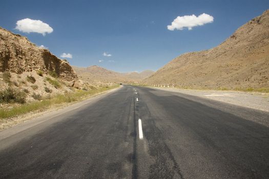 Straight route on the desert. Mountain view - Armenia.