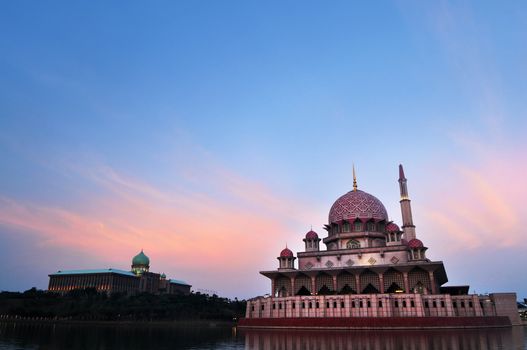 Putra Mosque is the principal mosque of Putrajaya, Malaysia. Building on the left is Perdana Putra which is Malaysian Prime Minister's office.