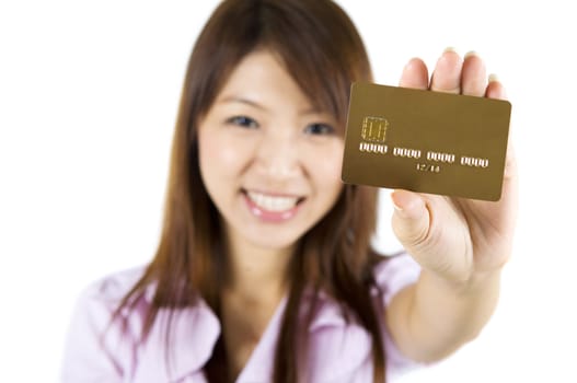 Asian woman holding a credit card, focus on the card. Card number and expiry date created by my own.