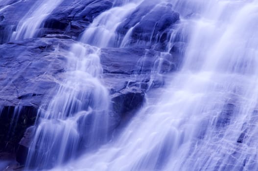 Waterfall in japanese garden, blue tone.