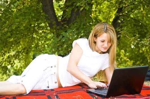 beautiful young woman working out with laptop or notebook