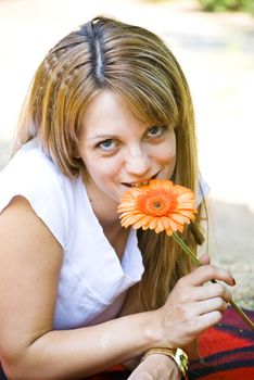 beautiful young blonde woman with flower