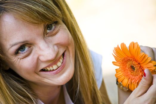 beautiful young blonde woman with flower