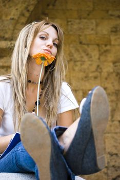 beautiful young blonde woman with flower