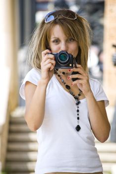 beautiful young woman taking photos