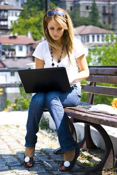 beautiful young woman working out with laptop or notebook