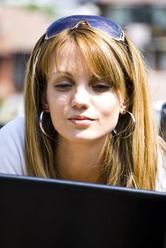 beautiful young woman working out with laptop or notebook