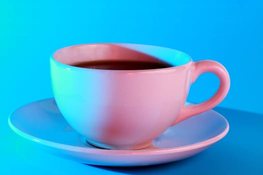 coffee in a pink cup, blue light