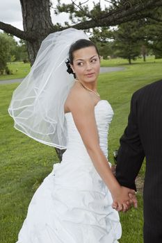 Just married bride looking behind her