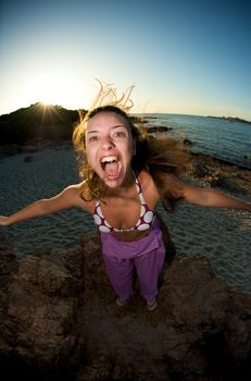 Crazy woman enjoying the beach