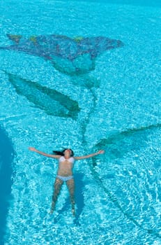 Woman relaxing in the spa swimming pool