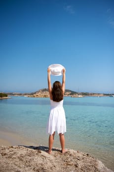 Pretty woman enjoying her vacation in Sardinia