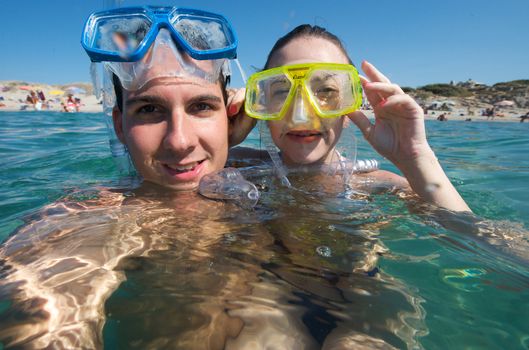 Lovely couple enjoying snorkeling during their vacation