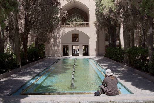 Tourist in Fin Garden in Kashan - Iran. Fountain