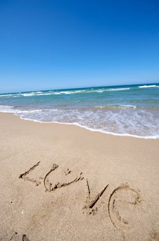 Message writing on a wonderful beach