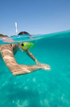 Underwater view of a woman swimming in the ocean