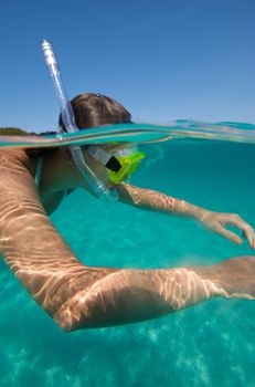 Underwater view of a woman swimming in the ocean