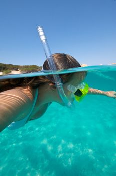 Underwater view of a woman swimming in the ocean