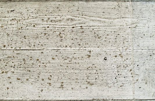 A textured patterned wall of concrete. Copyprint of wood.