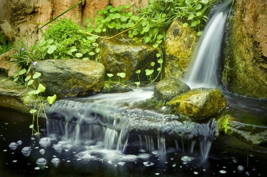 Japanese garden waterfalls, slow shutter. 
