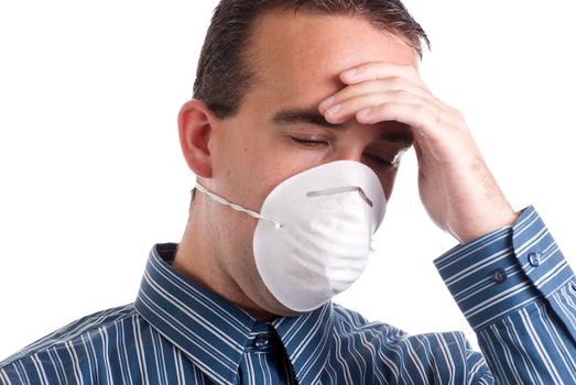 A young man with a respiratory infection is wearing a mask to protect others and is suffering from a headache, isolated against a white background