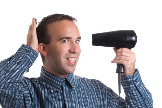 Concept image of metrosexual male featuring a young male using a hair dryer to fix his hair nicely, isolated against a white background