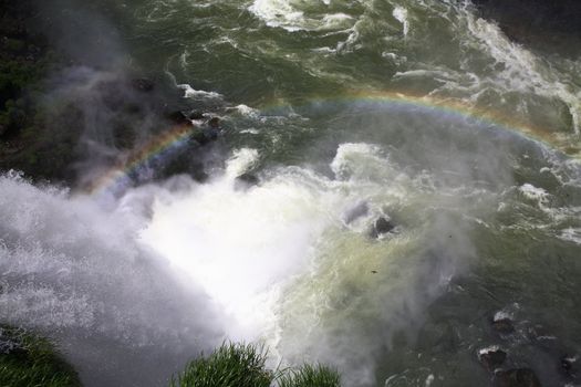 The Iguassu (or Iguazu) Falls is one of the largest masses of fresh water on the planet and divides, in South America, Brazil, Paraguay and Argentina. The waterfall system consists of 275 falls along 2.7 kilometres (1.67 miles) of the Iguazu River. Some of the individual falls are up to 82 metres (269 feet) in height, though the majority are about 64 metres (210 feet).