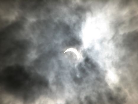 Partial solar eclipse in the clouds. Ukraine. March 29, 2006. 