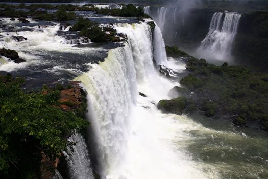 The Iguassu (or Iguazu) Falls is one of the largest masses of fresh water on the planet and divides, in South America, Brazil, Paraguay and Argentina. The waterfall system consists of 275 falls along 2.7 kilometres (1.67 miles) of the Iguazu River. Some of the individual falls are up to 82 metres (269 feet) in height, though the majority are about 64 metres (210 feet).