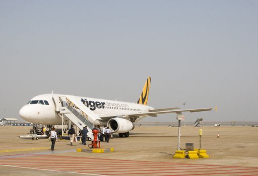 Tiger Airways accepting passengers at Macao Airport, on its way to Singapore. 
