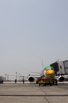 Nok Air. One of Thailand's budget airlines is parked for service and maintenance at Bangkok's domestic airport.