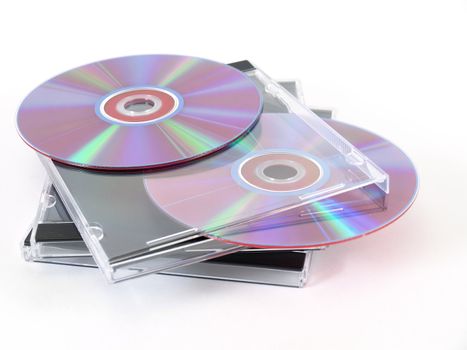 Blank compact disks with clear jewel cases isolated against a white background.
