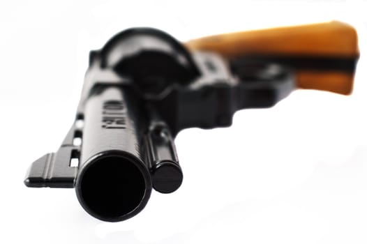 Close-up of a revolver with shallow depth of field isolated on white