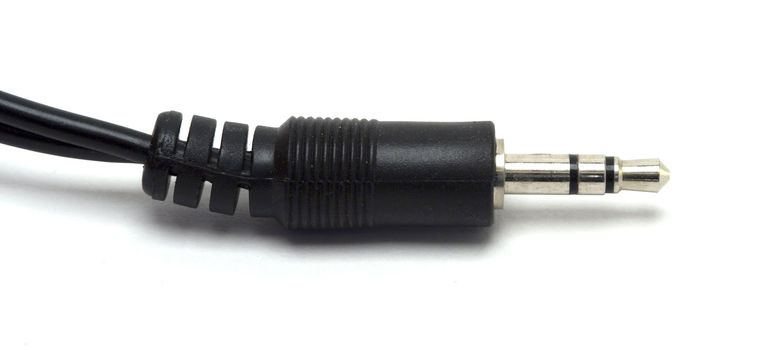 Closeup, isolated shot of a 1/8 stereo cable against a white background.