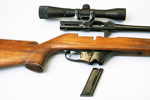 The disassembled rifle with an optical sight