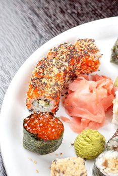 japanese sushi set with red caviar sushi in the foreground
