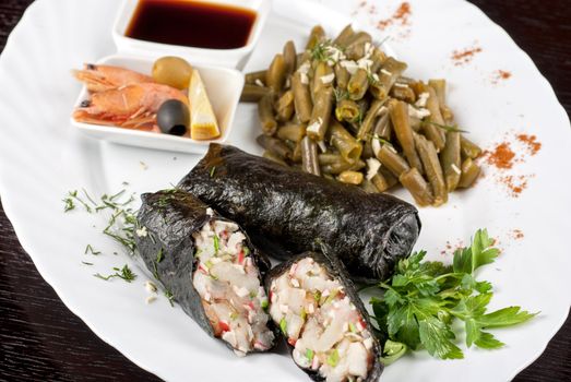 souffle of fillet of pikeperch, shrimps, crab meat, coconut and leek wrapped at nori garnished by string beans