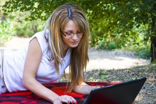 beautiful young woman working out with laptop or notebook