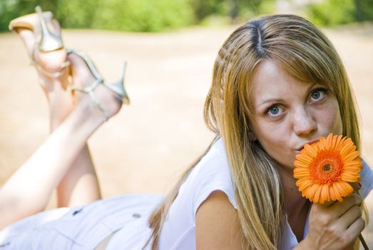 beautiful young blonde woman with flower